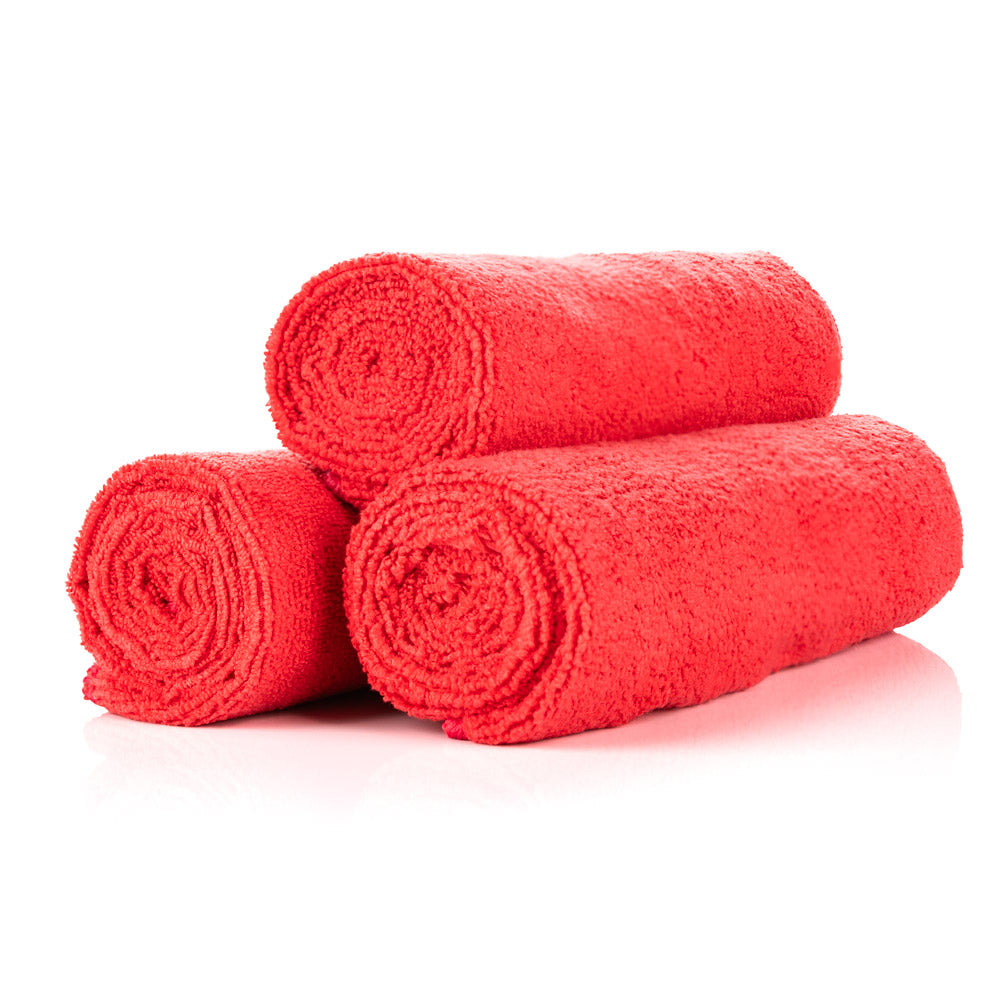 3 red towels rolled up